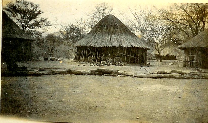 Thatched houses around an open clearing at Jumbe's village